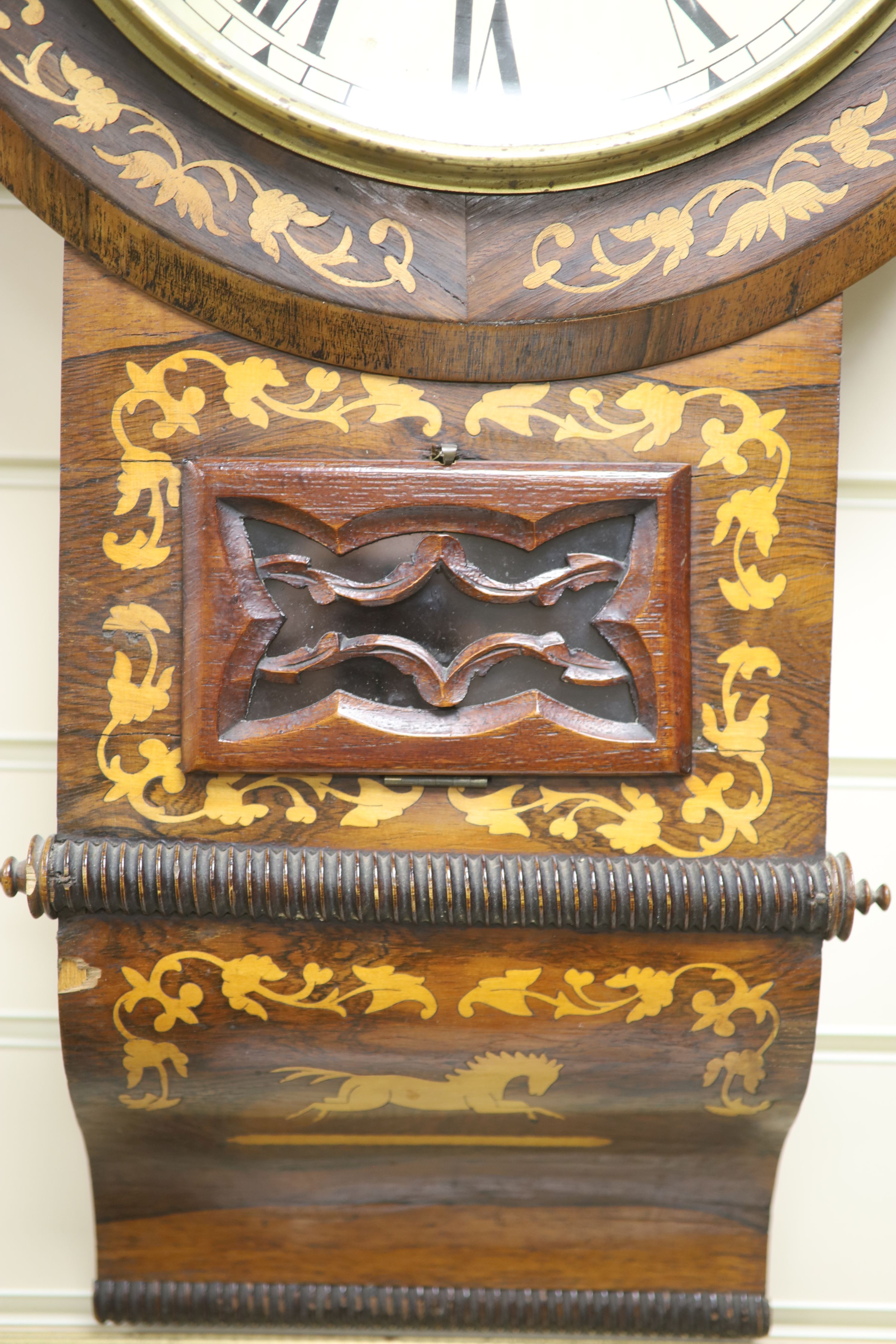 A Victorian inlaid rosewood wall clock